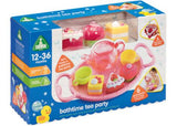 Colorful floating tea party set with six accessories, including cake squirters, cups, and shape sorting tray for imaginative bath fun.