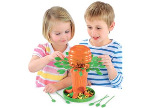 Colorful game featuring a honey tree, bees, and leaves, teaching fine motor skills and teamwork for 2-4 players.