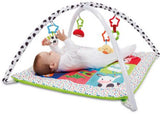 Soft Blossom Farm playmat with removable arches and four colorful toys for safe and sensory baby playtime.