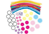Colorful DIY hair bands kit with fabric strips, flowers, and beads for creative kids aged 6 and up. Perfect for parties!