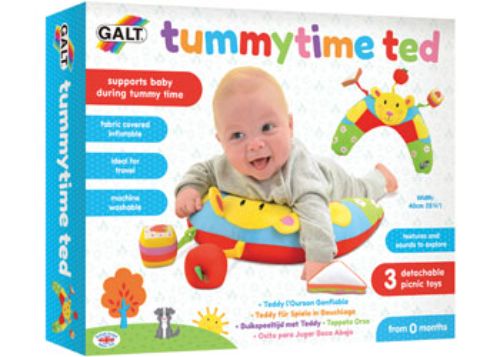 Soft teddy bear Tummytime Ted with picnic scene, includes detachable toys for sensory play and tummy time support.