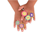 Colorful crafting kit with fabric flowers and stickers to create 12 unique flower rings for kids aged 6 and up.