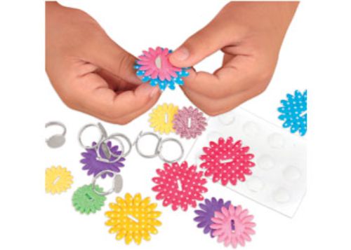 Colorful crafting kit for kids to create and wear 12 unique flower rings using fabric flowers and stickers.