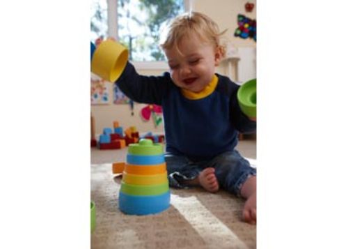 Eco-friendly Green Toys Stacker with eight colorful pieces for toddlers, promoting motor skills and imaginative play.