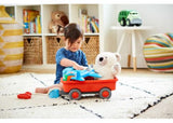 Eco-friendly Green Toys Wagon in bright colors, featuring a cotton rope handle and sturdy construction for safe play.