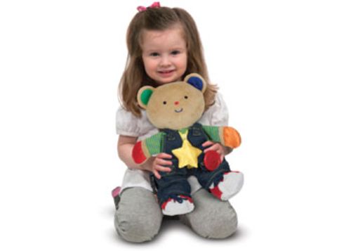 Plush bear Teddy Wear features removable clothing with buttons, zippers, and laces for hands-on learning and skill development.