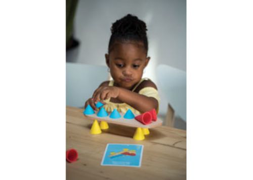 Colorful Piks Small Kit features 24 construction pieces, including silicone cones and wooden boards, fostering creativity and skill development.