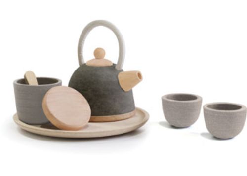 Wooden Oriental tea set for kids, featuring a teapot, two cups, bowl, and tray; promotes imaginative play and social skills.