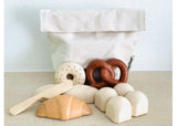 Wooden bread set featuring various types of bread, ideal for imaginative play and learning about food for kids 3 and up.