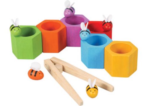 Colorful PlanToys Beehives set with bees and hives, designed for creative play and fine motor skill development in children 3+.