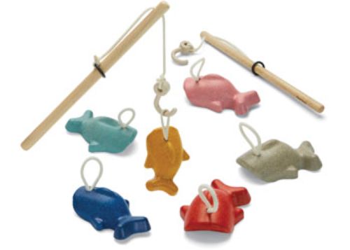Colorful wooden fish and a magnetic rod in the sustainable PlanToys Fishing Game, promoting fun and learning for kids.