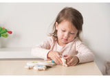 Wooden lacing toy in the shape of a sheep, promoting fine motor skills and imaginative play for toddlers aged 3 and up.