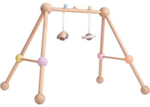 Pastel-colored PlanToys Play Gym with two detachable toys, promoting baby's motor skills and safe exploration.