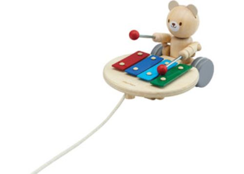 Wooden Pull-Along Musical Bear toy, promotes motor skills, eco-friendly, features enchanting melodies for playful exploration.