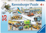 Colorful Ravensburger Busy Airport Puzzle for kids, featuring a lively airport scene with planes and passengers. 35 pieces, 30 x 21 cm.