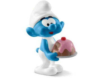 Charming Greedy Smurf figure holding a cake, perfect for imaginative play and Smurfs collectors.