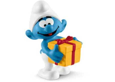 Jokey Smurf holding a present, known for his playful pranks, colorful details perfect for collectors and imaginative play.