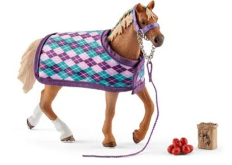 Schleich English Thoroughbred model with blanket, showcasing detailed features for imaginative play and horse care education.