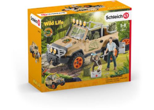 Schleich 4x4 vehicle with winch features Ranger David and a chimp, perfect for jungle rescue adventures and imaginative play.