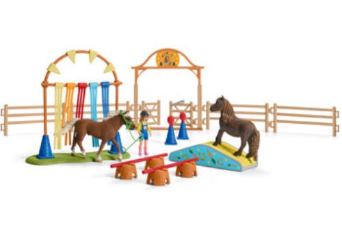 Schleich Pony Agility Training set featuring hand-painted ponies navigating jumps, tunnels, and weave poles for imaginative play.