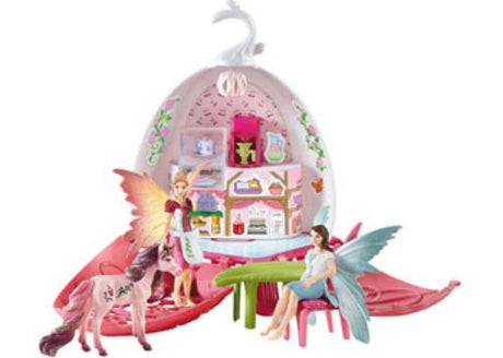 Colorful Schleich Fairy Café Blossom playset featuring fairies, mushroom tables, and enchanting trees for imaginative play.