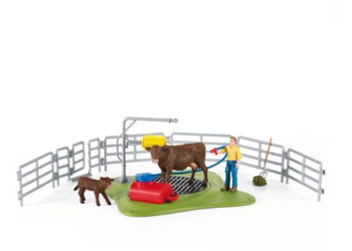 Colorful playset featuring a wash station and a cute cow, encouraging imaginative animal care and role-playing fun.