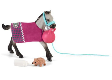 Schleich Playful Foal with colorful ball, cozy blanket, and hedgehog friend, perfect for imaginative play and storytelling.