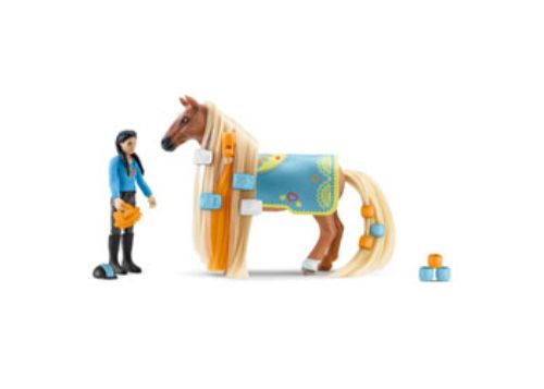 A detailed figurine of Kim with her beautifully crafted horse Caramelo, perfect for imaginative play and storytelling.