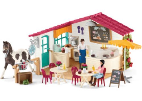 Detailed figurine of a stylish rider in equestrian attire relaxing at a charming café, perfect for imaginative play.