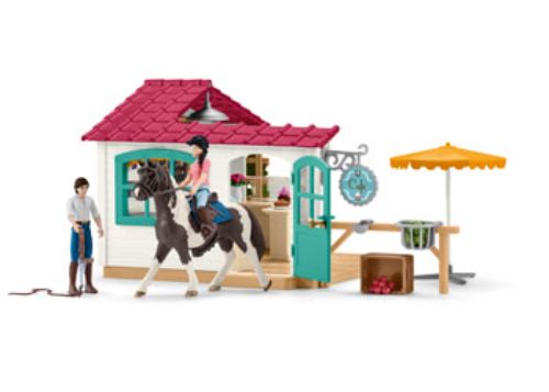 Detailed equestrian rider figurine from Schleich, perfect for imaginative play and storytelling in a cozy café setting.