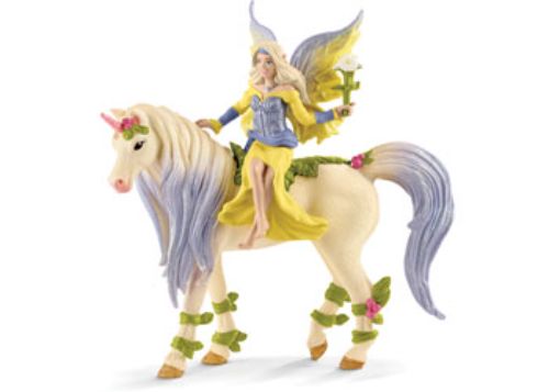 Fairy Sera gently rides her vibrant Blossom Unicorn in a magical forest, showcasing friendship and imaginative play.