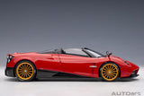 Meticulously detailed 1/18 diecast model of the Pagani Huayra Roadster in Rosso Monza Red, perfect for collectors.