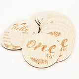 Engraved NZ floral milestone discs set for baby growth photos, featuring 14 pine veneer discs with unique Kiwiana designs.