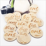 Milestone Discs Set featuring 14 engraved pine veneer discs with NZ floral designs for capturing baby's growth memories.