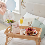 Customisable Breakfast in Bed Set featuring a scratch-to-reveal menu, drink topper, cake topper, cupcake toppers, and balloons.