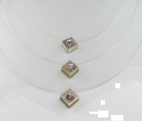 Three-strand nylon necklace with a stylish square pendant, perfect for elevating any outfit.