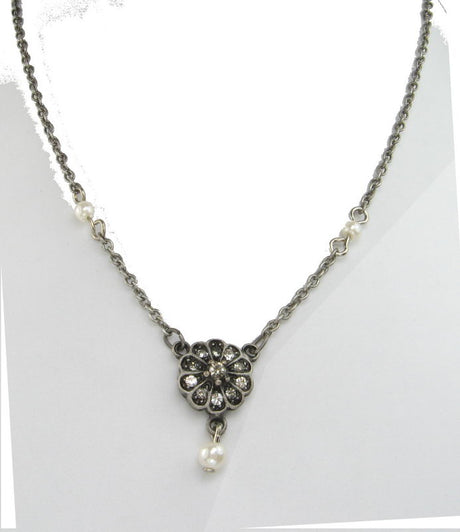 Handcrafted grey necklace featuring unique pewter beads and elegant drops, perfect for any occasion.