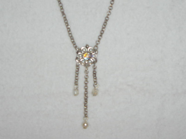 Delicate white pearl necklace with daisy accents and three drops, perfect for enhancing any outfit.