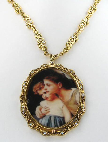 Gold necklace featuring a pendant of two sisters hugging, celebrating sisterhood and love.