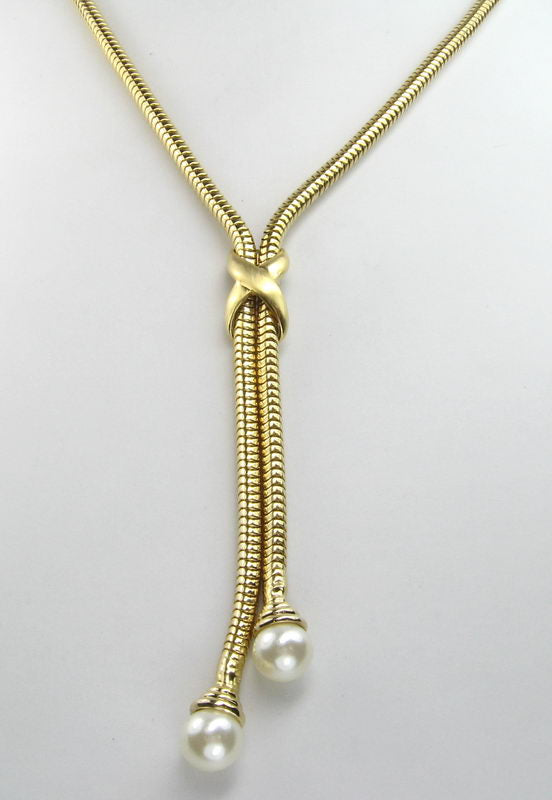 Sleek snake chain necklace with luxurious pearl ends, perfect for elevating any outfit.