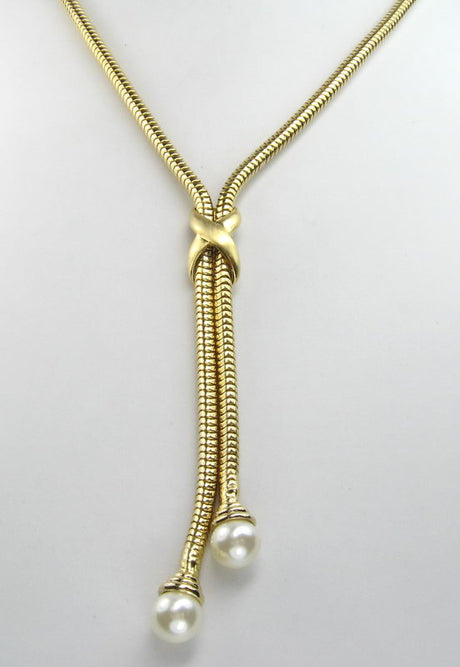 Sleek snake chain necklace with luxurious pearl ends, perfect for elevating any outfit.