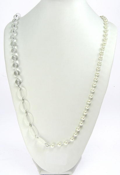 Elegant necklace featuring lustrous pearls, radiant clear crystals, and unique opaque accents for versatile styling.