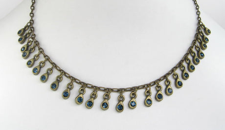 Stylish blue brass chain necklace with elegant drop accents, perfect for any occasion and jewelry collection.