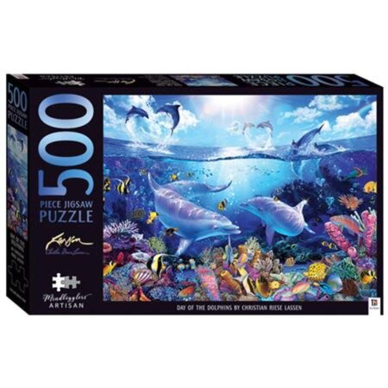 Colorful 500-piece jigsaw puzzle featuring dolphins and a vibrant coral reef by Christian Riese Lassen, measuring 610mm x 457mm.