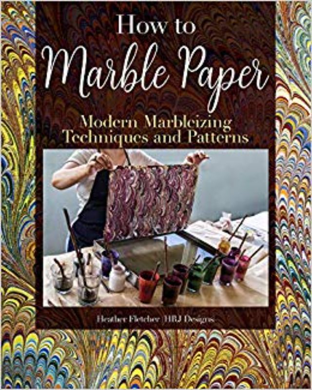 "Book cover of 'How to Marble Paper,' showcasing vibrant marbling patterns and techniques for creative paper art."
