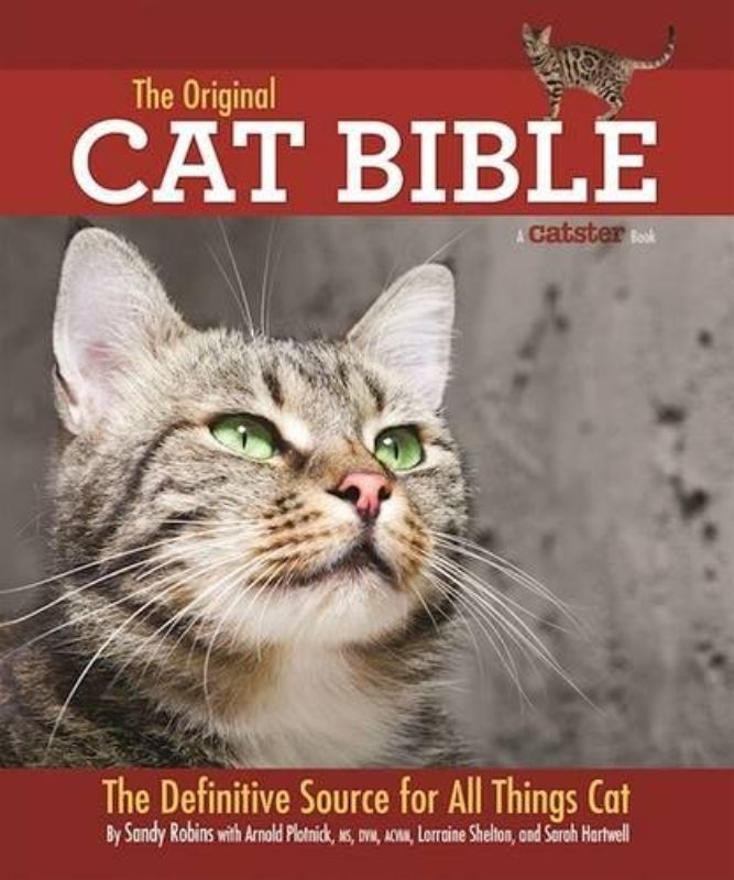 The Original Cat Bible, a comprehensive 544-page guide for cat owners filled with expert insights on feline care, breeds, and behavior.
