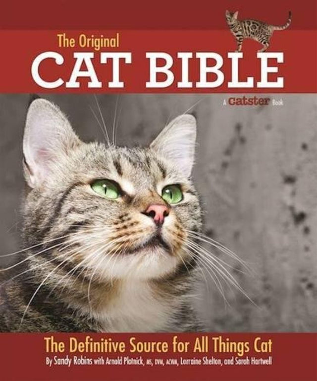 The Original Cat Bible, a comprehensive 544-page guide for cat owners filled with expert insights on feline care, breeds, and behavior.