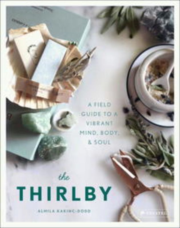 Hardback book "The Thirlby" by Almila Kakinc-Dodd on holistic living, featuring self-care tips, recipes, and spiritual guidance.