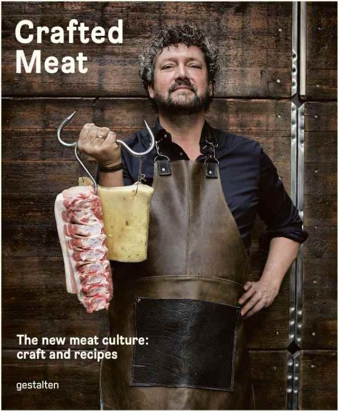 A hardback book titled "Crafted Meat," featuring recipes and tips for artisanal charcuterie and gourmet meat preparation.