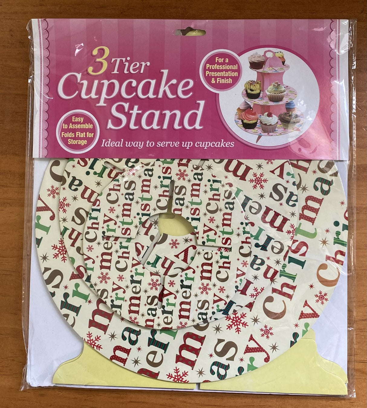 Three-tiered Christmas cupcake stand set featuring assorted designs, perfect for festive dessert displays and celebrations.